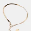 Conjunto de tobilleras con cadena en espiga dorada