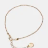 Conjunto de tobilleras con cadena en espiga dorada