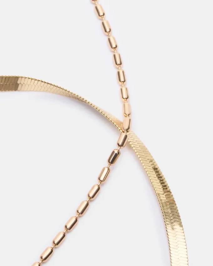 Conjunto de tobilleras con cadena en espiga dorada