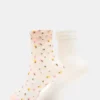 Paquete de 2 pares de calcetines de tul con estampado de flores silvestres en color rosa palo Paquete de 2 pares de calcetines de tul con estampado de flores silvestres en color rosa palo
