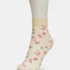 Paquete de 2 pares de calcetines tobilleros transparentes con diseño floral, color vainilla Paquete de 2 pares de calcetines tobilleros transparentes con diseño floral, color vainilla