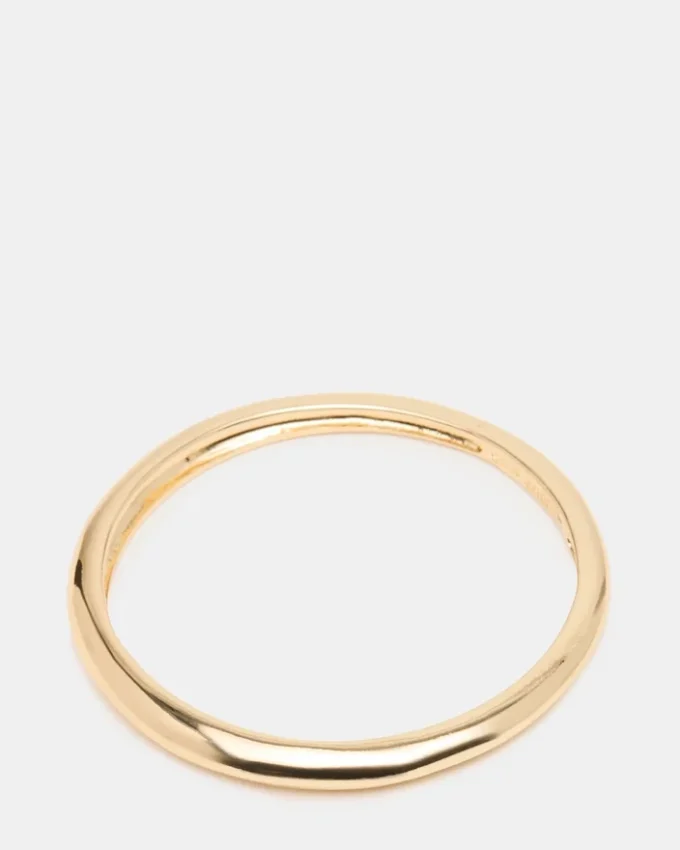 Pulsera tipo brazalete delgada dorada